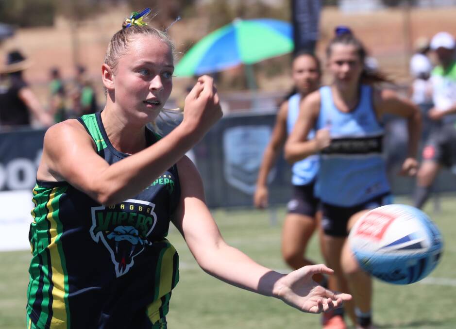 CHAMPIONSHIPS RETURN: Wagga Viper Ash Reynoldson makes a pass during last year's Junior State Cup Southern Conference carnival at Jubilee Park. Picture: Les Smith