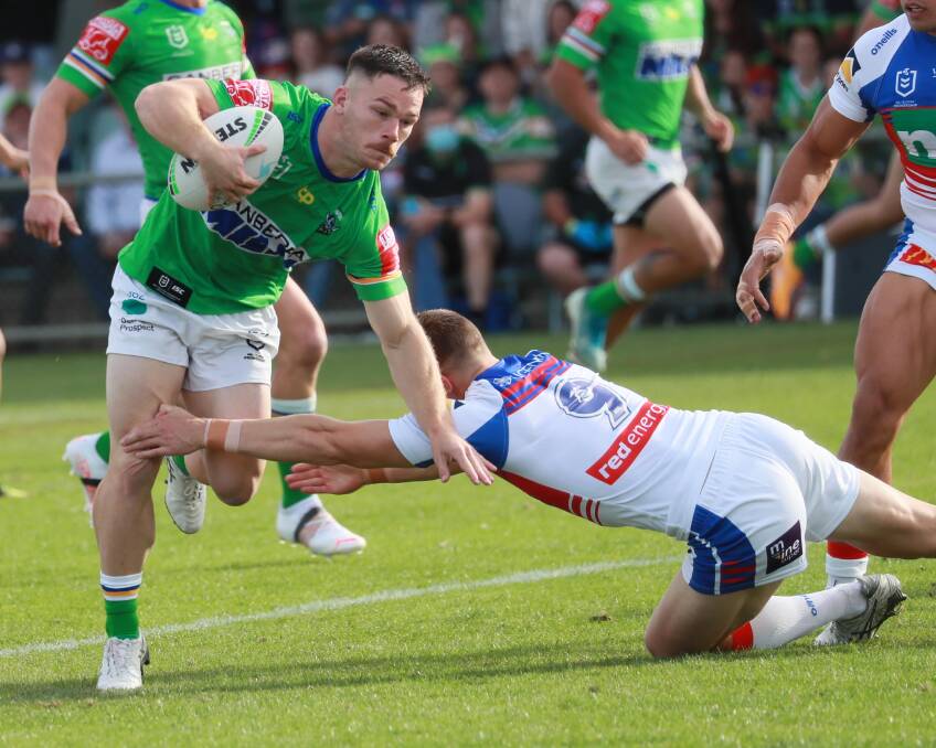 FIFTH STRAIGHT LOSS: Canberra hooker Josh Starling tries to evade opposite number Jayden Brailey during Saturday's 24-16 loss to Newcastle in Wagga. Picture: Les Smith