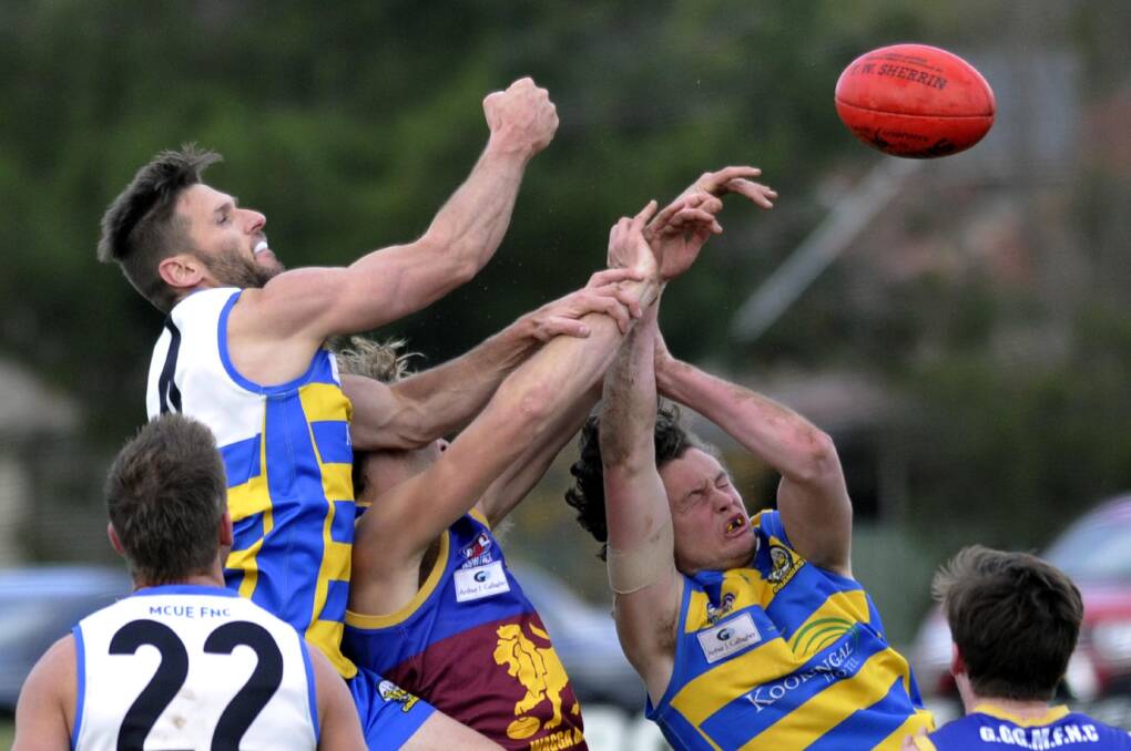 COMING HOME?: Colin Sanbrook (left) makes a spoil
during a game against Ganmain-Grong Grong-Matong
in 2015. Picture: Les Smith