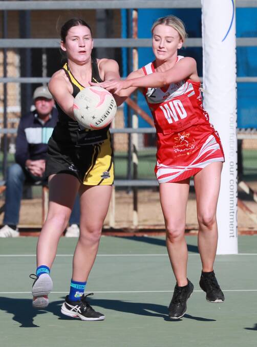 CLIFFHANGER: Wagga Tiger Eliza Kelly and Demon Molly Radley battle for possesion during the Tigers' two goal win on Saturday. Picture: Les Smith