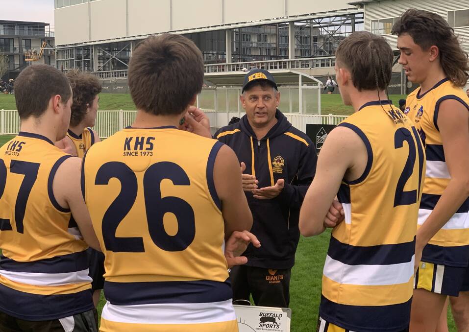 GAME PLAN: Kooringal High coach Andrew Schmetzer addresses his team at half time of Wednesday's win over Wagga High. Picture: Jon Tuxworth