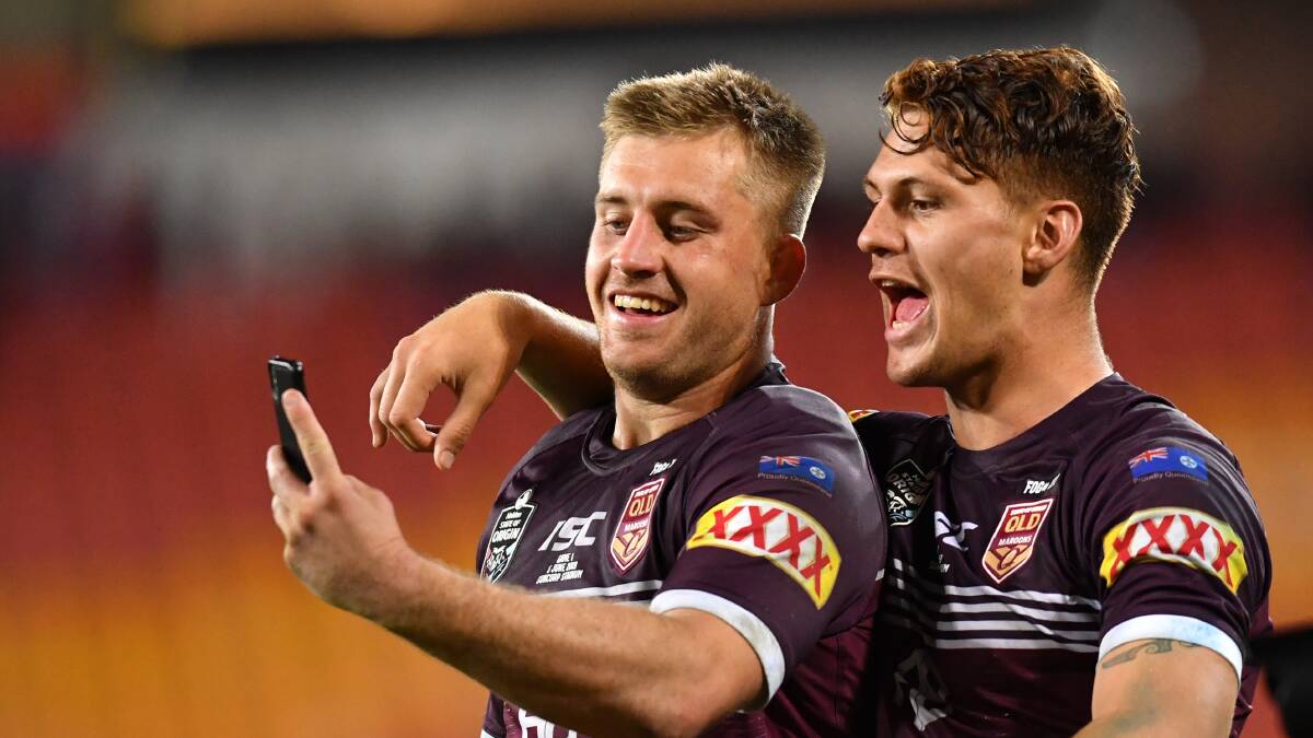 DYNAMIC DUO: Queensland's Cameron Munster and Kalyn Ponga celebrate after Origin I. Picture: AAP Image/Darren England