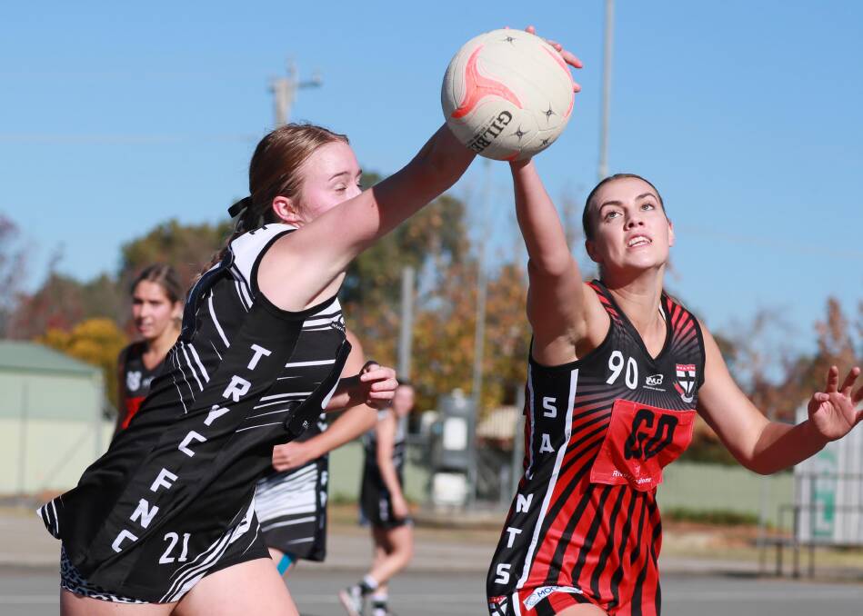 JOSTLE: The Rock-Yerong Creek's Alexi Fellows and North Wagga's Sarah O'Leary battle for the ball. Picture: Les Smith