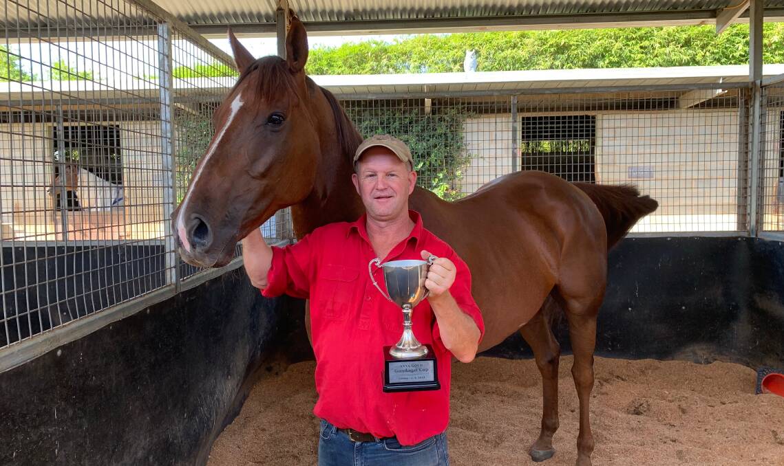 WINNING FORM: Trainer Chris Heywood with the Gundagai Cup after Class Clown's victory earlier this month. 