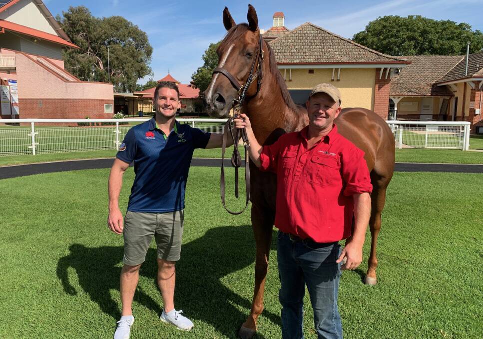 BIG WEEKEND: Canberra Raiders co-captain Jarrod Croker and Wagga trainer Chris Heywood with Gundagai Cup winner Class Clown on Monday. The Raiders play Penrith the day after the Wagga Gold Cup next month. 