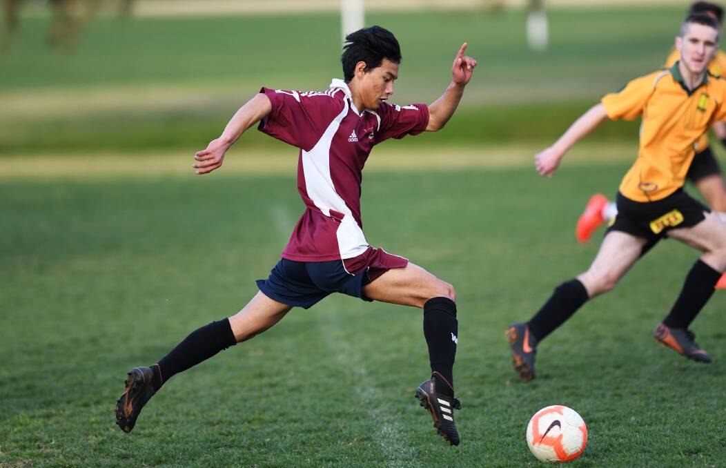 FLEET FOOTED: Wagga Wagga Christian College's Moses Redamwang stretches out during Wednesday's Creed Cup clash against Mount Austin High School. 