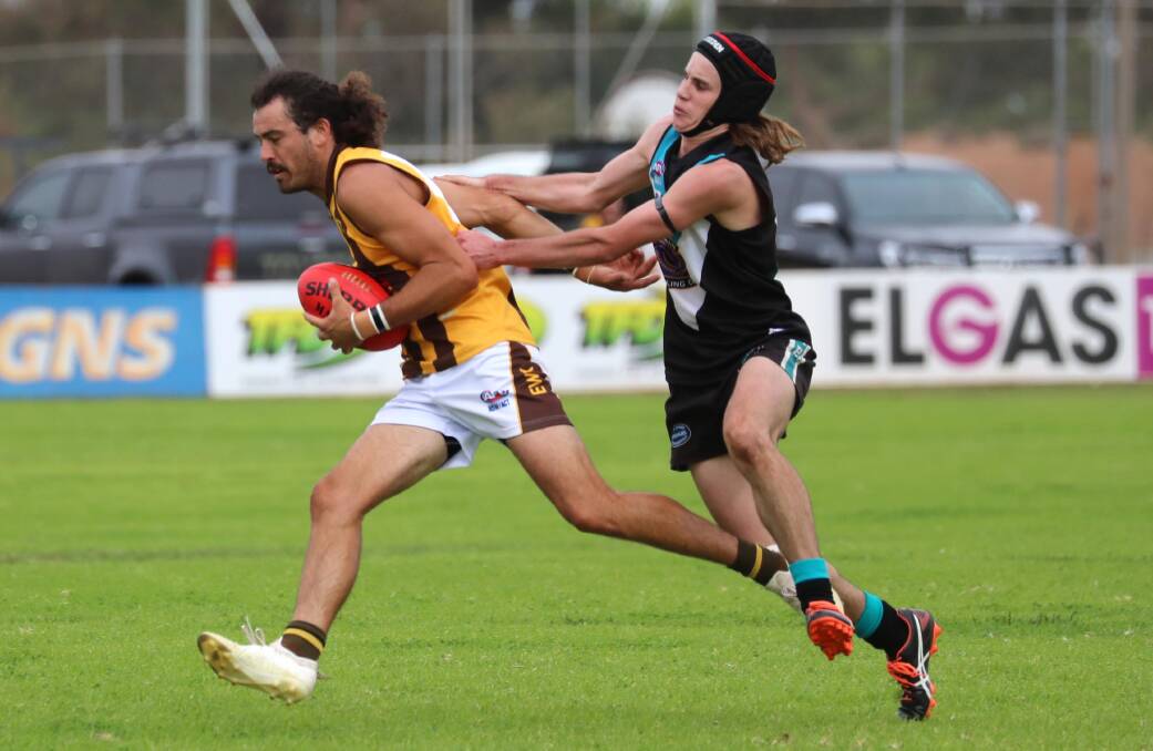 HAWKS OUT: East Wagga-Kooringal's Brocke Argus
tries to shake off Northern Jets' Henry Grinter in a Farrer
League game last year. Picture: Les Smith
