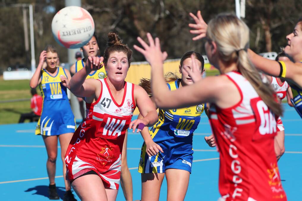 TOP TWO CLASH: Collingullie-Glenfield Park's Bree Wood makes a pass during their Riverina League netball loss to MCUE on Saturday. Picture: Emma Hillier