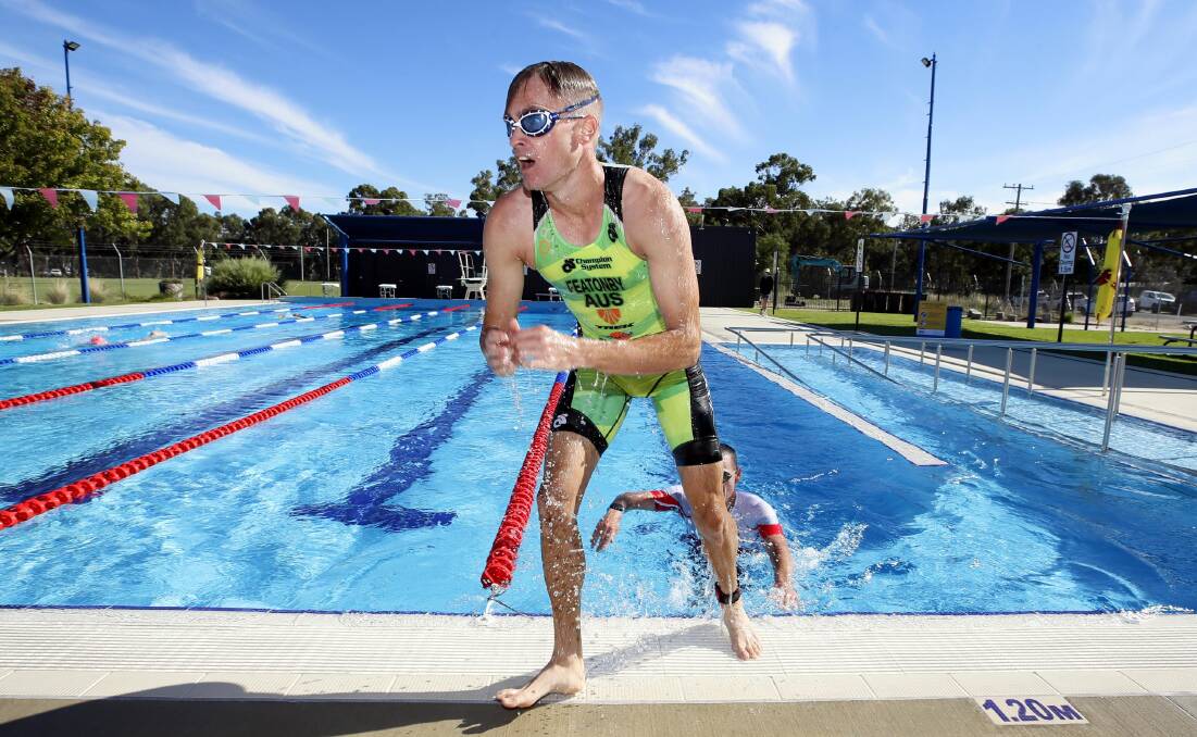 TOO CLASSY: Albury's Jesse Featonby emerges from the swim leg on his way to victory at Sunday's The Rock Triathlon. Picture: Les Smith