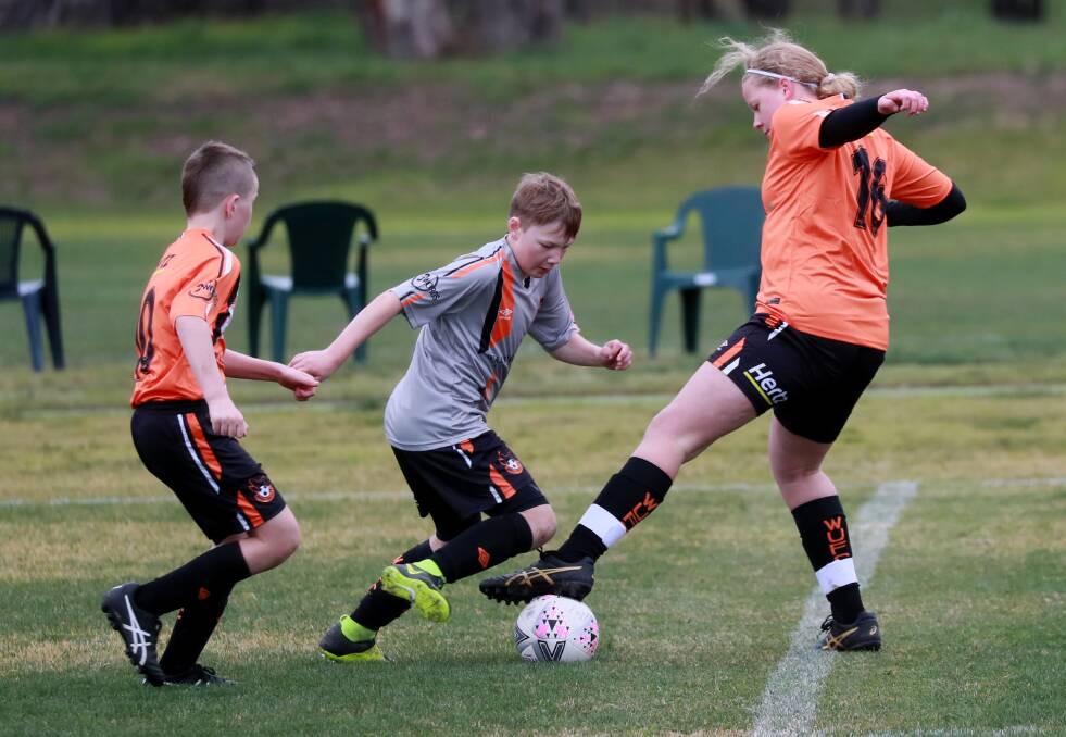 Junior soccer returned to action with the opening round of fixtures on Saturday, including under-13 games between Wagga United Crows and Wagga United Swifts, and Tolland against Henwood Park. Pictures: Les Smith