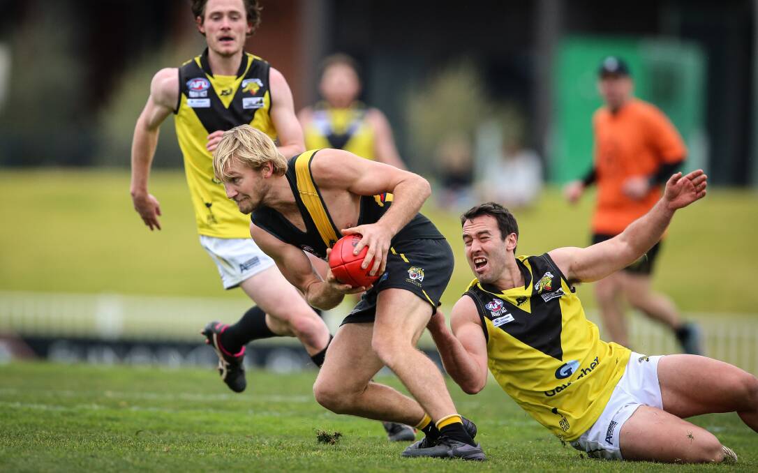 BACK ON FIELD: Wagga Tigers' Zac Brain and Osborne's Guy Ward lock horns during last week's round one clash at Robertson Oval. Picture: James Wiltshire/Getty Images