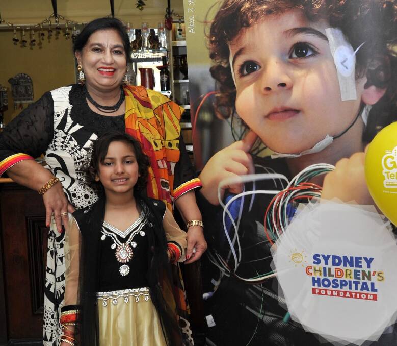 GIVING BACK: Rabina Singh with Benazir Ali at a Bollywood -themed fundraiser in Wagga for the Royal Children's Hospital in Sydney. Picture: Les Smith