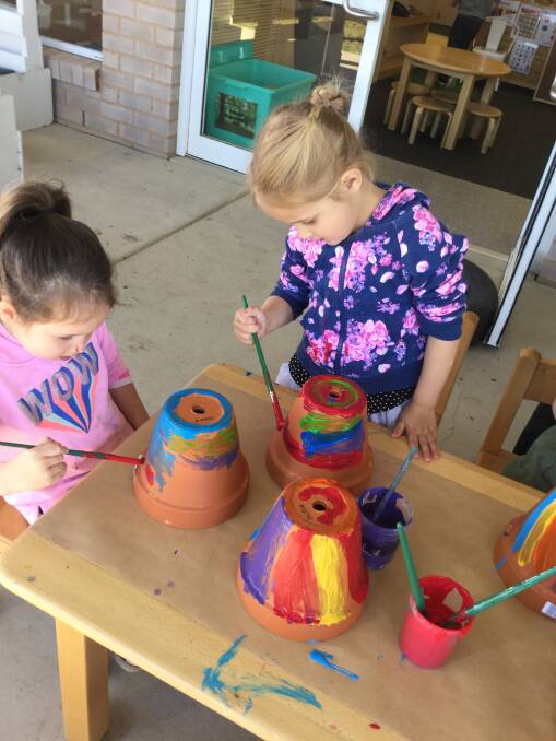 RAINBOW BRIGHT: Children at Wagga Early Years Learning Centre painted rainbow pots for their upcoming rainbow week for Mia Stewart.