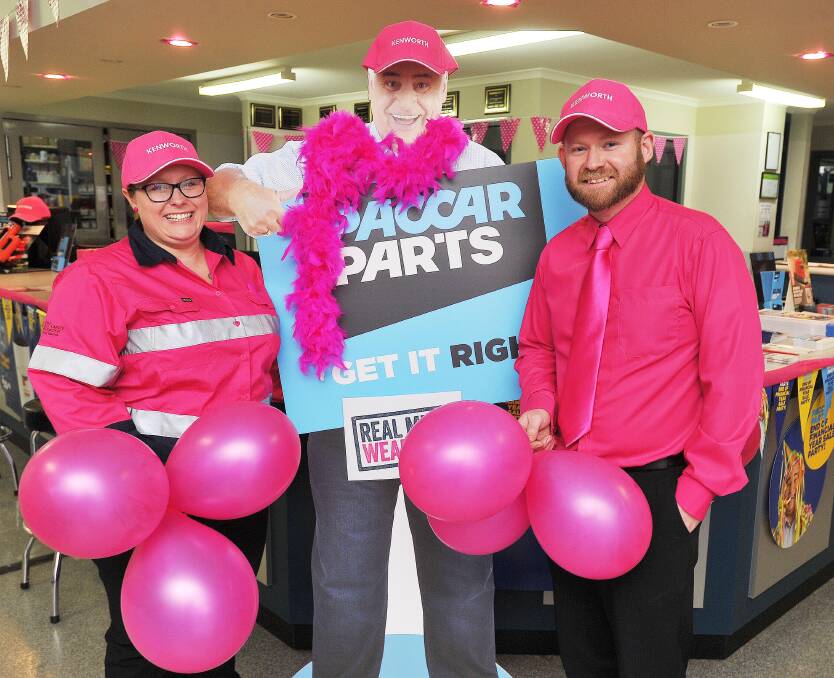 REAL MEN WEAR PINK: Inland Truck Centres' service advisor Sommer Denning and parts manager Joel Bray prepare for their fundraiser on Friday. Picture: Kieren L Tilly 