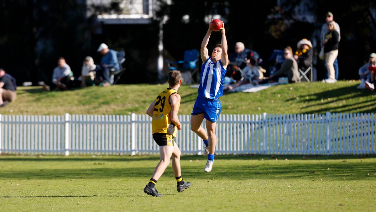 Max Harper takes a mark for Figtree during the AFL South Coast finals series. Picture by Anna Warr