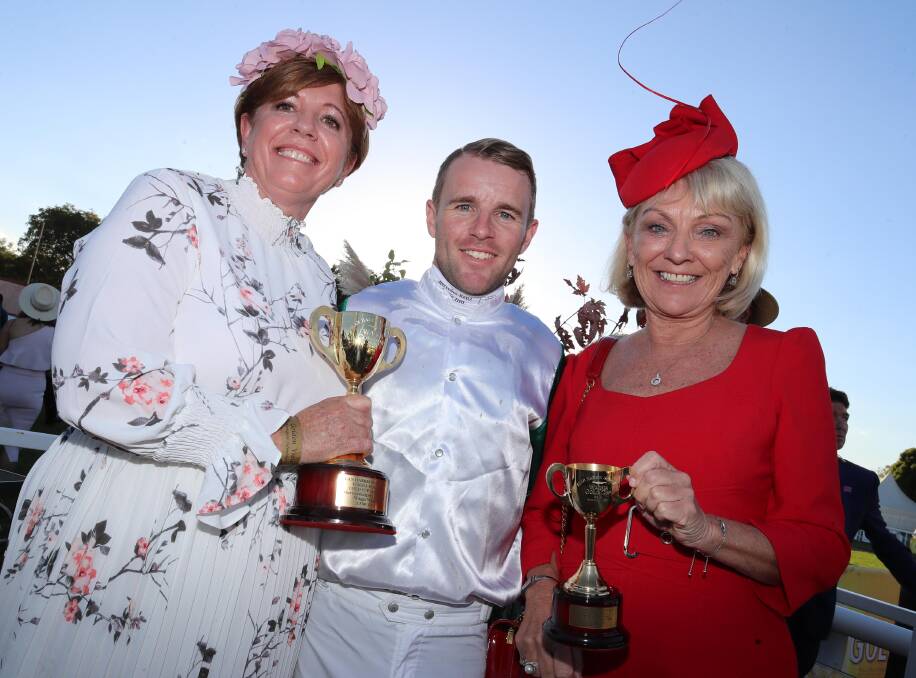CUP TRIUMPH: Tommy Berry with part owners of Abdon, Lisa Woodley and Maree Lowe, at the Wagga Gold Cup on Friday. Pictures: Les Smith