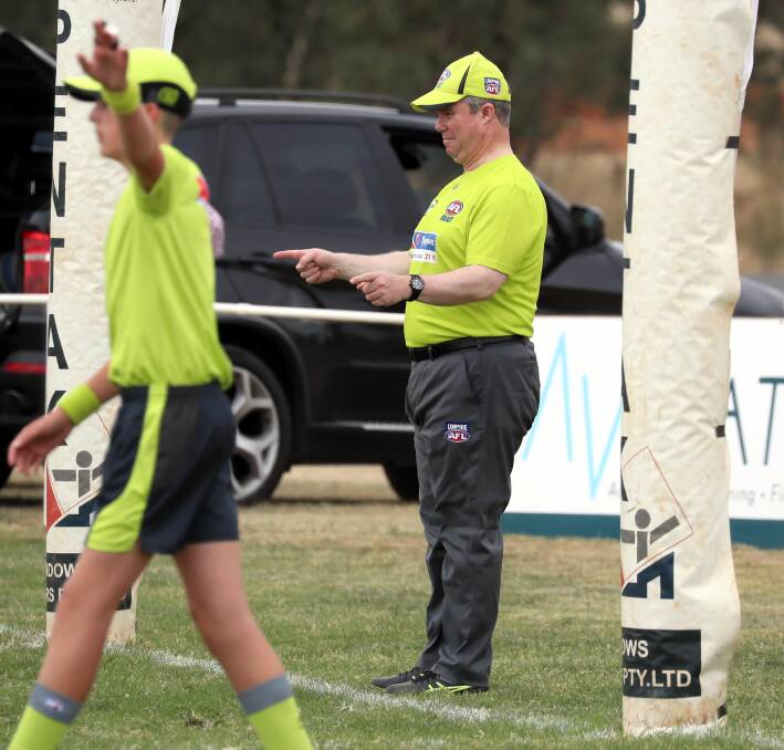 Long-serving goal umpire Rick Firman OAM in action in the goals at a game at Langtry Oval in 2022. Picture by Les Smith