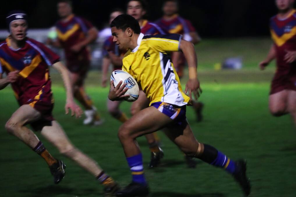 ON THE ATTACK: Kooringal High School's Joseph Oti takes on the Mater Dei Catholic College defence in the Hardy Shield game at Paramore Park on Monday night. Picture: Emma Hillier