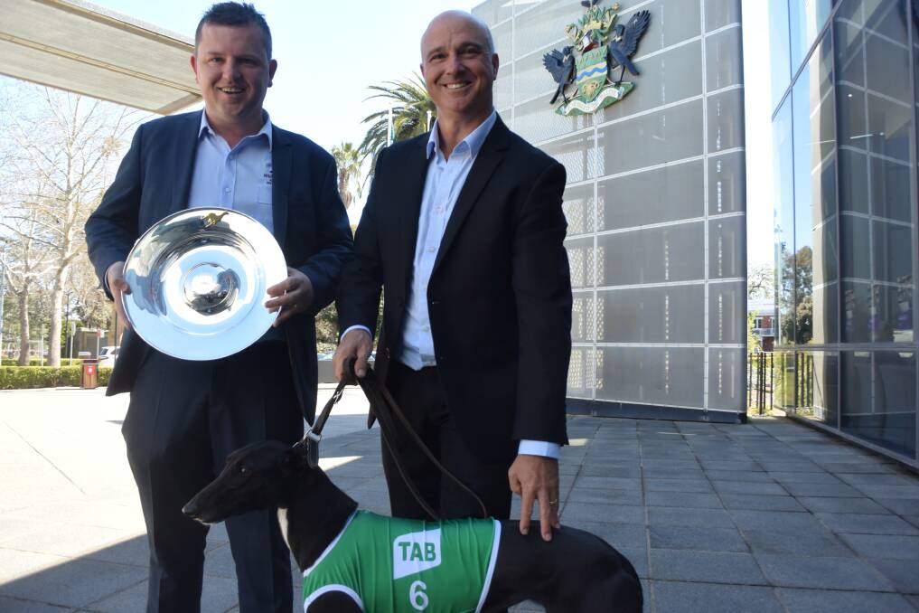 TIME TO SHINE: Wagga and District Greyhound Racing Club racing manager John Patton and Greyhound Racing NSW general manager racing operations Wayne Billett launch the Million Dollar Chase on Wednesday. Picture: Matt Malone