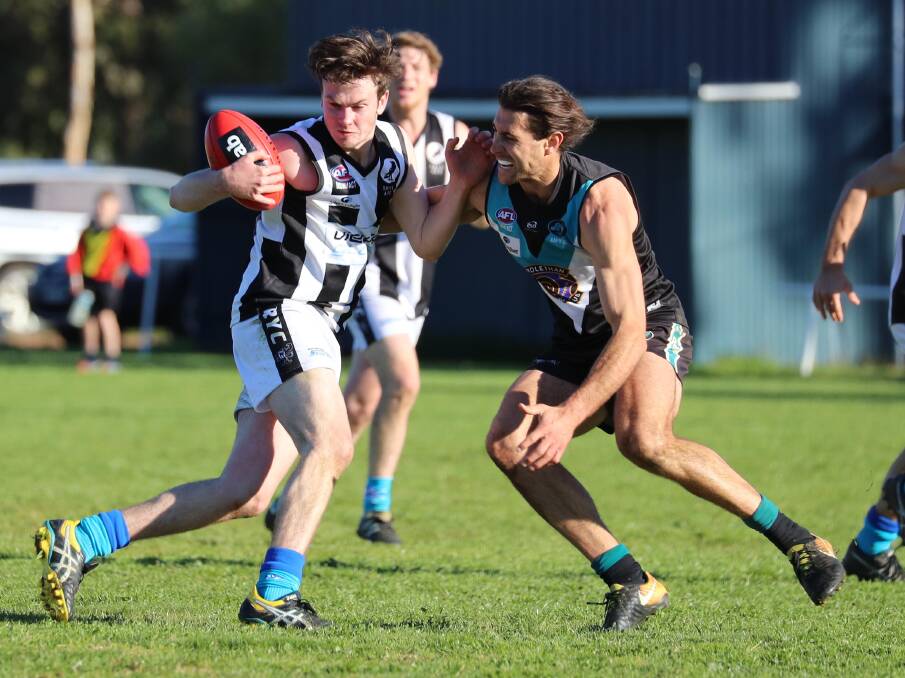 CRUNCH: The Rock-Yerong Creek's Wil Carroll gets met by Northern Jets coach Mitch Haddrill in the Farrer League game at Ardlethan on Saturday. Picture: Les Smith