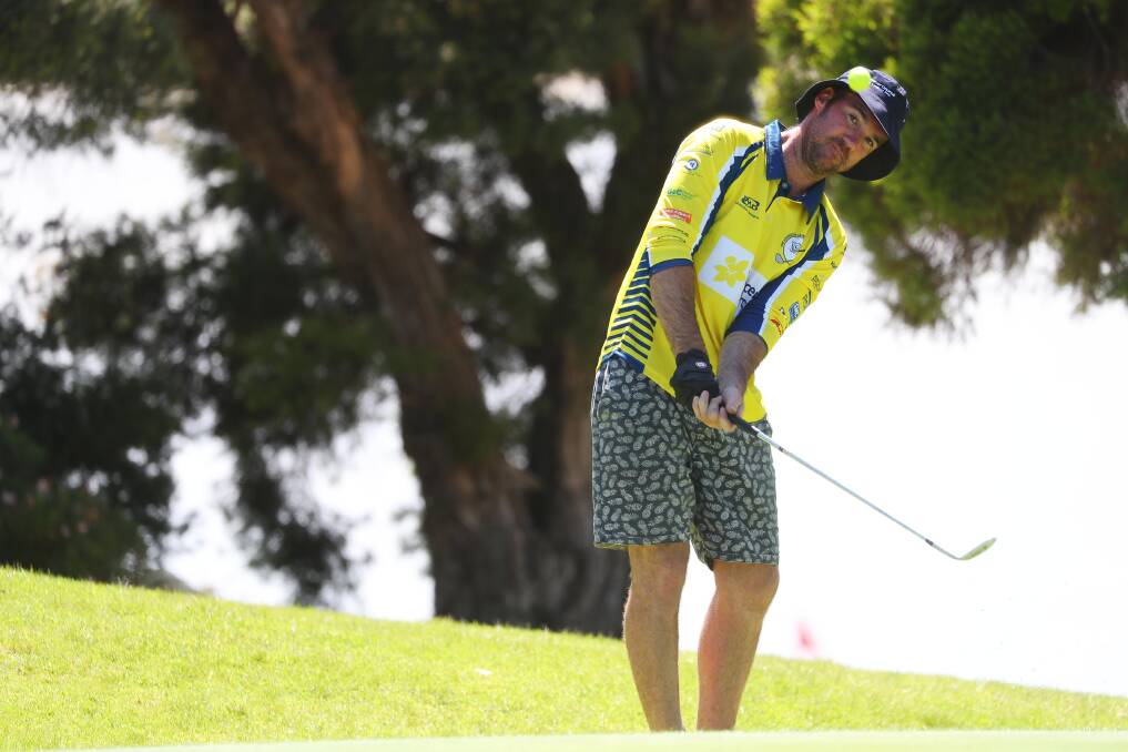 EYE ON THE PRIZE: Mitch Daniher chips onto the 18th green at Wagga Country Club on Monday as part of The Longest Day charity event. Picture: Emma Hillier
