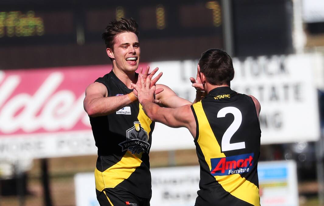 Sam and Nick Ryan celebrate an early goal against Griffith in the qualifying final. Picture: Emma Hillier