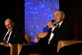 Wagga's Paul Kelly speaks on stage alongside good mate and former Sydney Swans teammate Tony 'Plugger' Lockhart at the NSW Australian Football Hall of Fame gala dinner at the SCG on Friday night. Picture by Nigel Owen