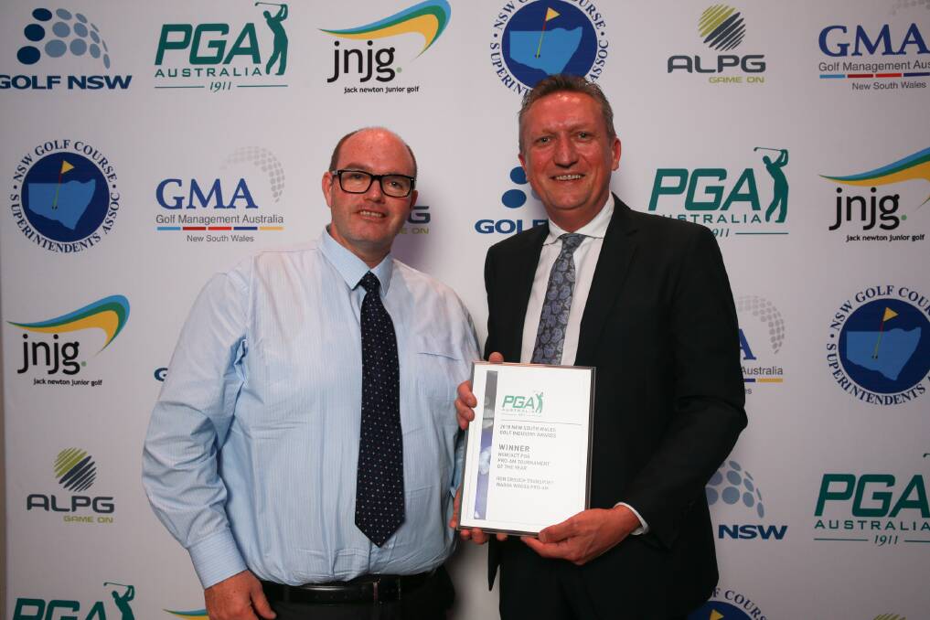 Wagga Country Club secretary-manager John Turner and Pro-Am major sponsor Geoff Crouch receive their award. Picture: Golf NSW