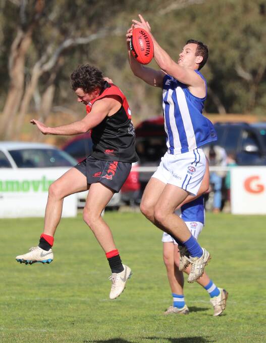 STRONG: Temora defender Max Richardson looks to take a mark over Marrar's Tyler Cunningham at Langtry Oval on Saturday. Picture: Les Smith