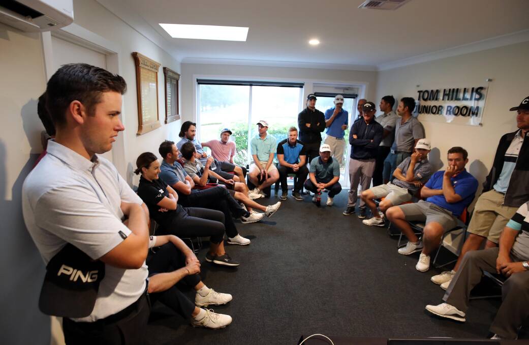 The professional players discuss the situation with the PGA official.
