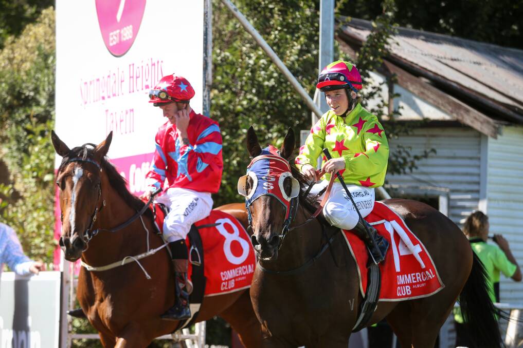 BIG WIN: Apprentice jockey Ellen Hennessy brings Demanding Mo (right) back to the yard after victory in the $75,000 Albury Guineas (1400m) last Friday. Picture: The Border Mail