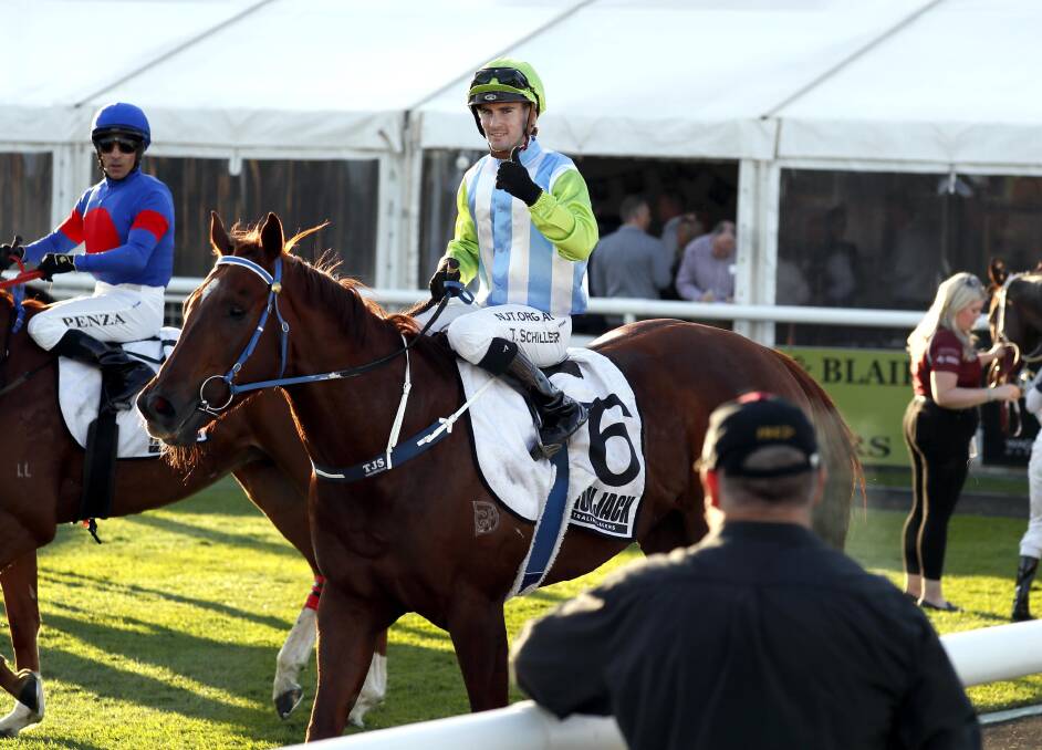 THUMBS UP: Tyler Schiller gives his approval after returning a big winner on Front Page in last Thursday's Wagga Town Plate. Picture: Les Smith