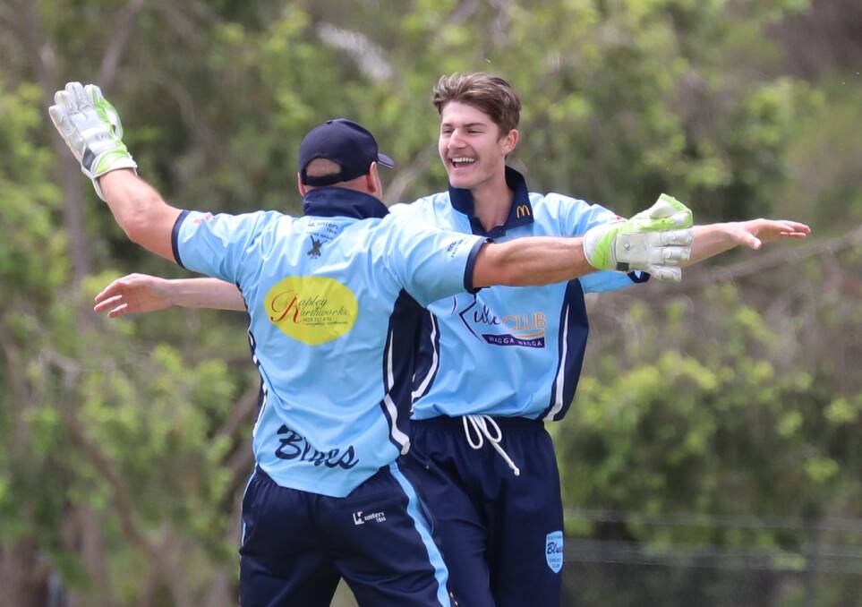 GOT HIM: South Wagga's Darcy Irvine and captain Jeremy Rowe celebrate the wicket of Lake Albert opener Nic Skelly on Saturday at Rawlings Park. Picture: Les Smith