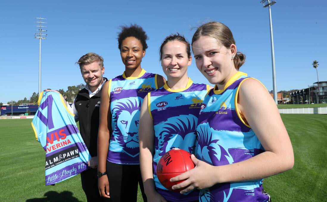 SPECIAL MOMENT: AVIS Riverina's Matt Wallace shows off the tribute jumpers with Riverina Lions players Natalia Ayesu, Jack Powell and Alex Lucas at Robertson Oval on Thursday. Picture: Les Smith