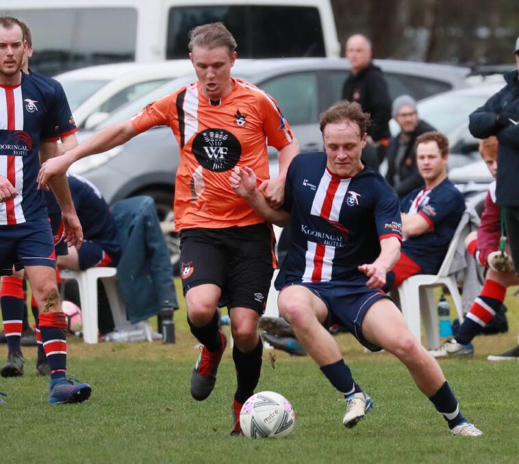Wagga United's Adrian Merrigan and Henwood Park's Matthew Cain battle it out during the Pascoe Cup game at Rawlings Park on Sunday. Picture: Les Smith
