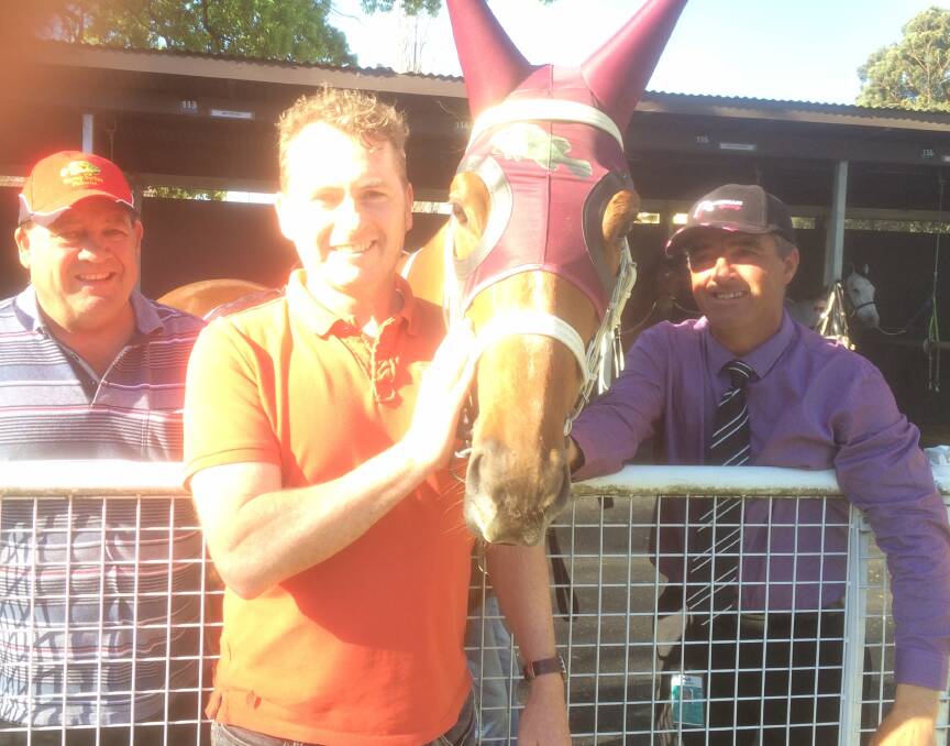 HAPPY DAYS: Owner Noel Penfold, slot holder Eamon Gormley and Wagga trainer
Scott Spackman with O' So Hazy on Wednesday at Warwick Farm.