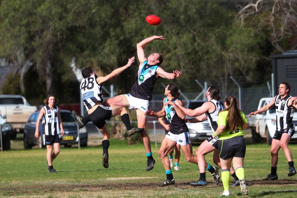 BIG MEN FLY: Northern Jets' Lachlan Jones gets over the top of TRYC's Jacob Adams-Wright at Victoria Park on Sunday. Picture: Emma Hillier