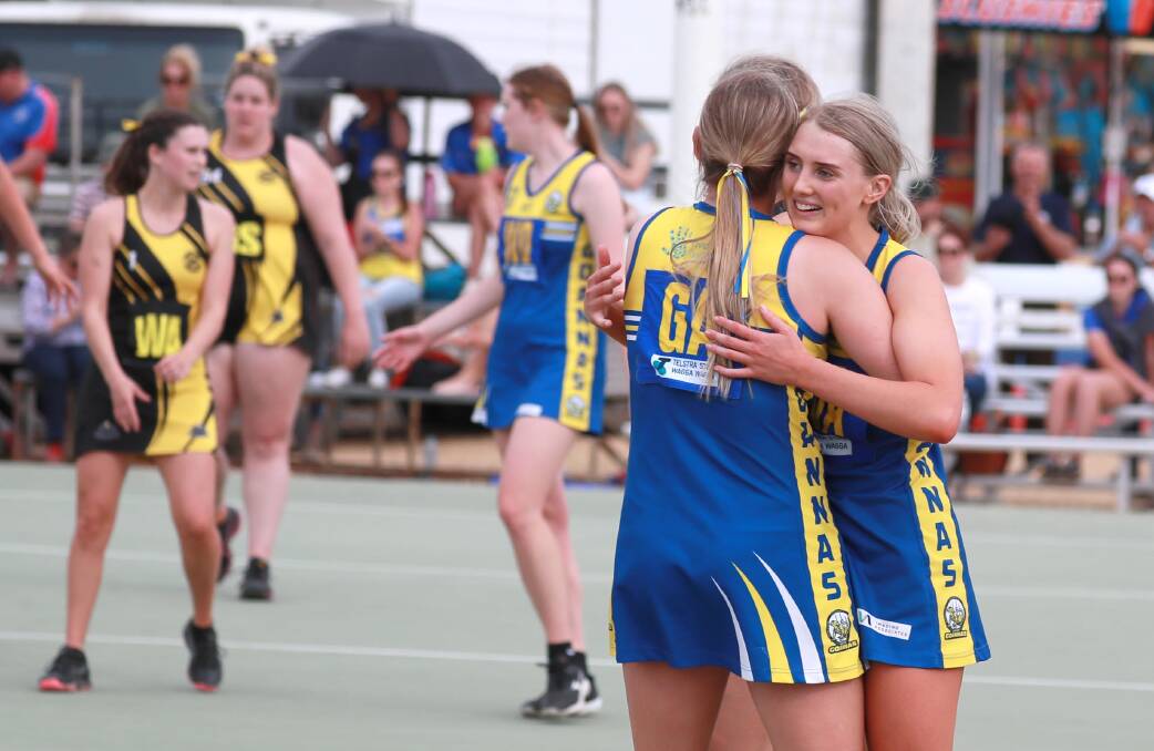 WE DID IT: MCUE captain Mikaela Cole embraces a teammate on Saturday after the final whistle in the A grade grand final. Picture: Les Smith