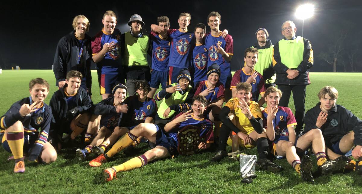 HAPPY DAYS: Mater Dei Catholic College celebrate their Creed Shield win at Rawlings Park on Wednesday night. Picture: Matt Malone