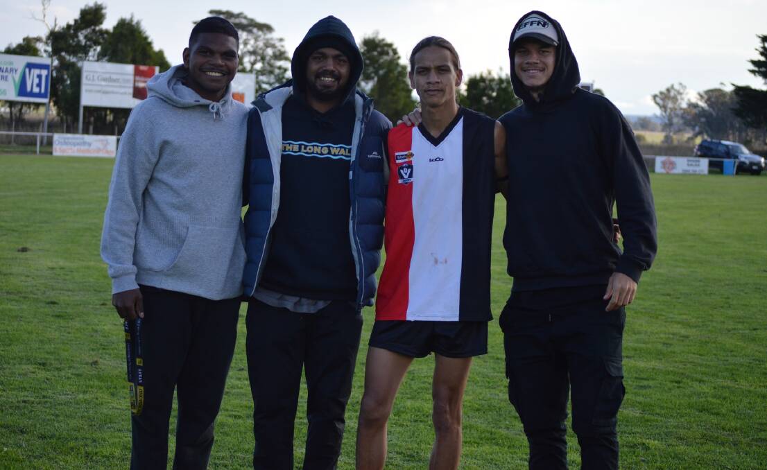 Brayden Rioli flanked by members of his family when playing for North Gippsland League club Cowwarr last year. Picture: Cowwarr FNC