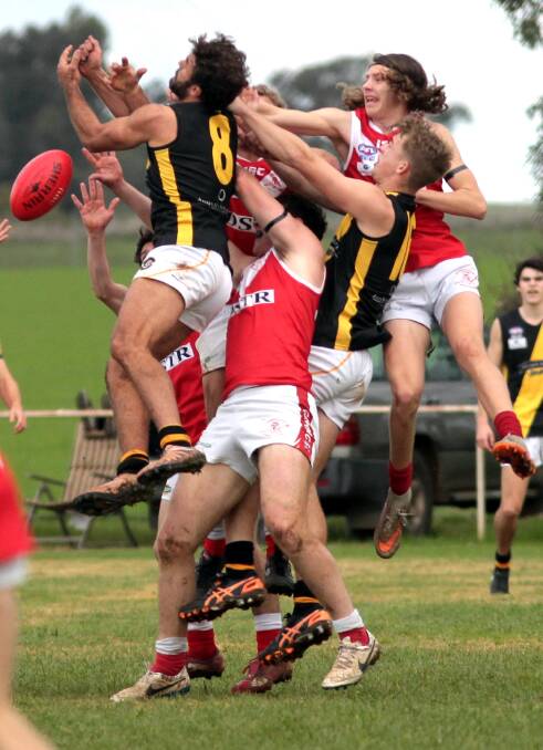 Jesse Manton (left) flies high for Wagga Tigers during the 2016 season.
