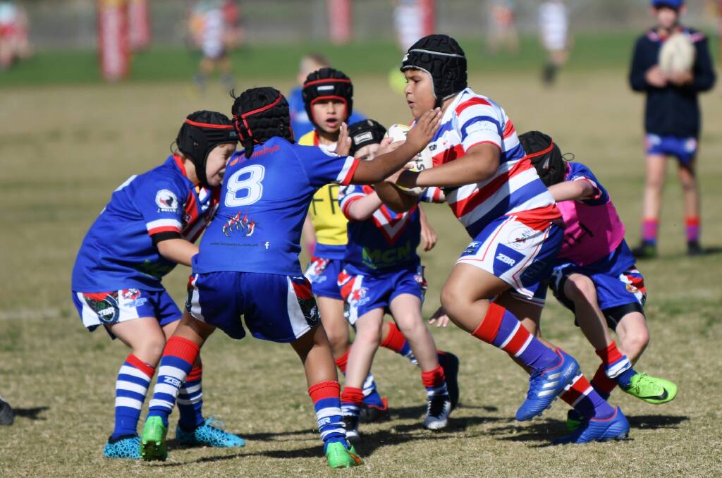  Young's Makali Freeman-Tonpi runs the ball up in a junior rugby league game against Turvey Park last year. 