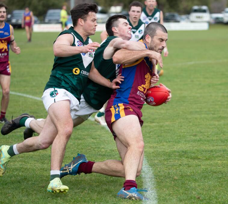 Mitch Mattingly makes a tackle on Ganmain-Grong Grong-Matong's Kirk Mahon when playing for Coolamon this year. Picture by Madeline Begley