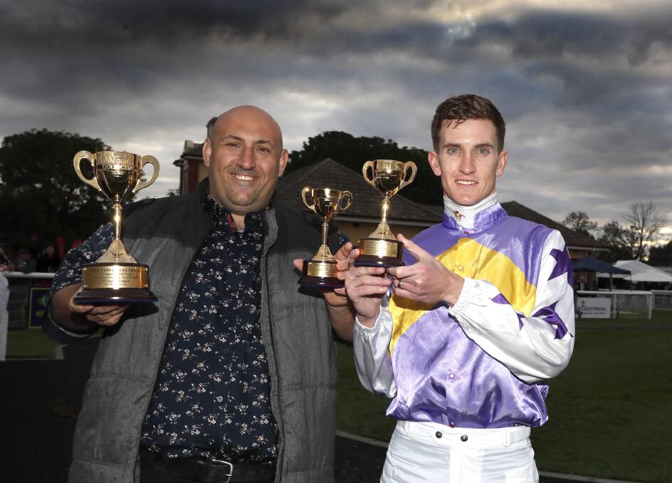 Chris Waller stable representative Bruno Briffa with winning jockey Chad Schofield. Picture: Les Smith