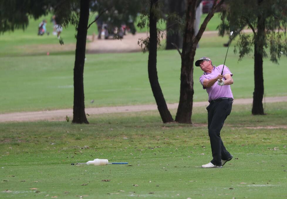 APPROACH: Richie Robinson keeps a close eye on his approach to the ninth green during the opening round of the Wagga Country Club championships on Saturday. Picture: Matt Malone
