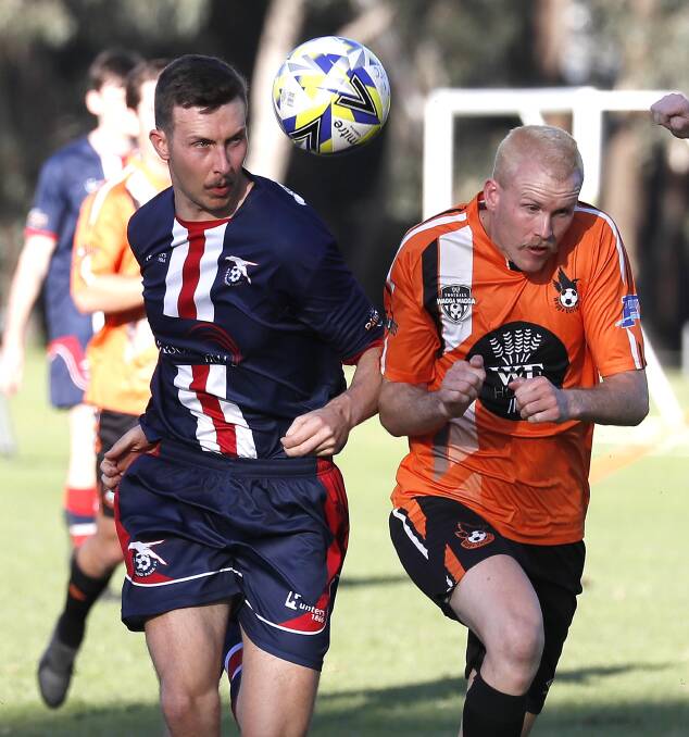 HEADS UP: Henwood Park's Matthew Cain and Wagga United's Aaron Harley compete in the Pascoe Cup game at Rawlings Park on Sunday. Picture: Les Smith