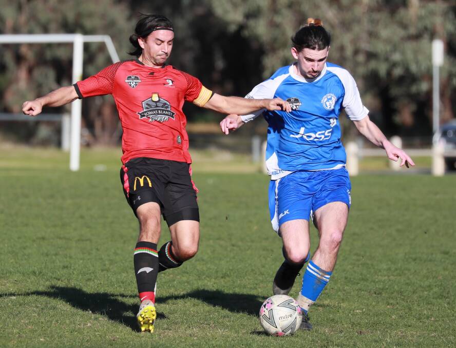 WAITING GAME: Lake Albert captain Ben Angel and Tolland's Oscar Williams battle for possession in a Pascoe Cup game earlier this month. Picture: Les Smith