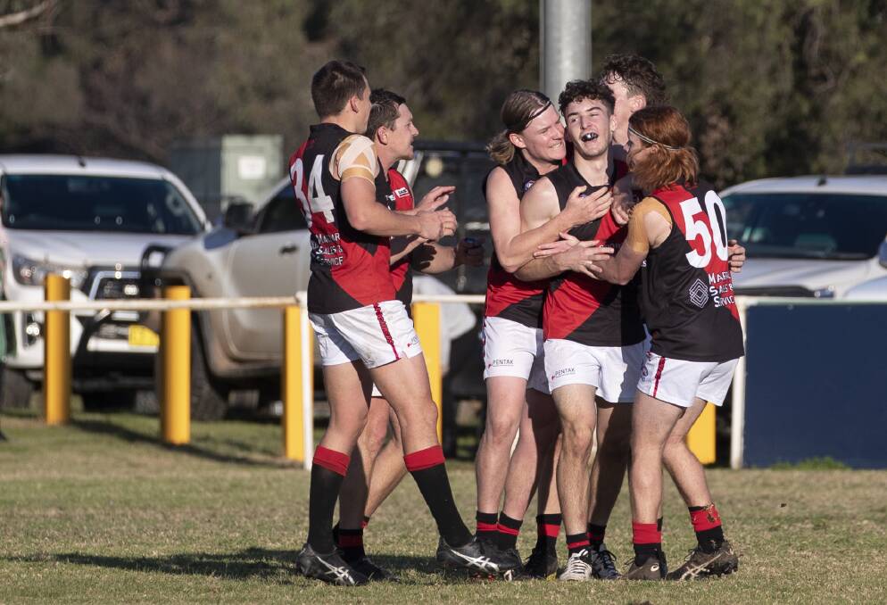 HAPPY DAYS: Marrar get around talented teenager Sam Emery after an important goal in the third term of the win over East Wagga-Kooringal at Gumly Oval on Saturday. Picture: Madeline Begley