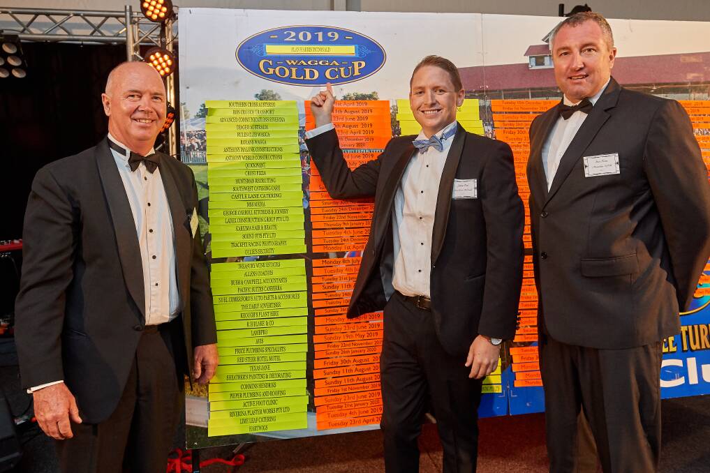 WINNER: Alan Harris McDonald manager Josh Paul is flanked by Murrumbidgee Turf Club (MTC) president Stuart Lamont (left) and new chief executive Steve Keene after winning Friday night's 100 Club draw. Picture: Michael Frogley Photography