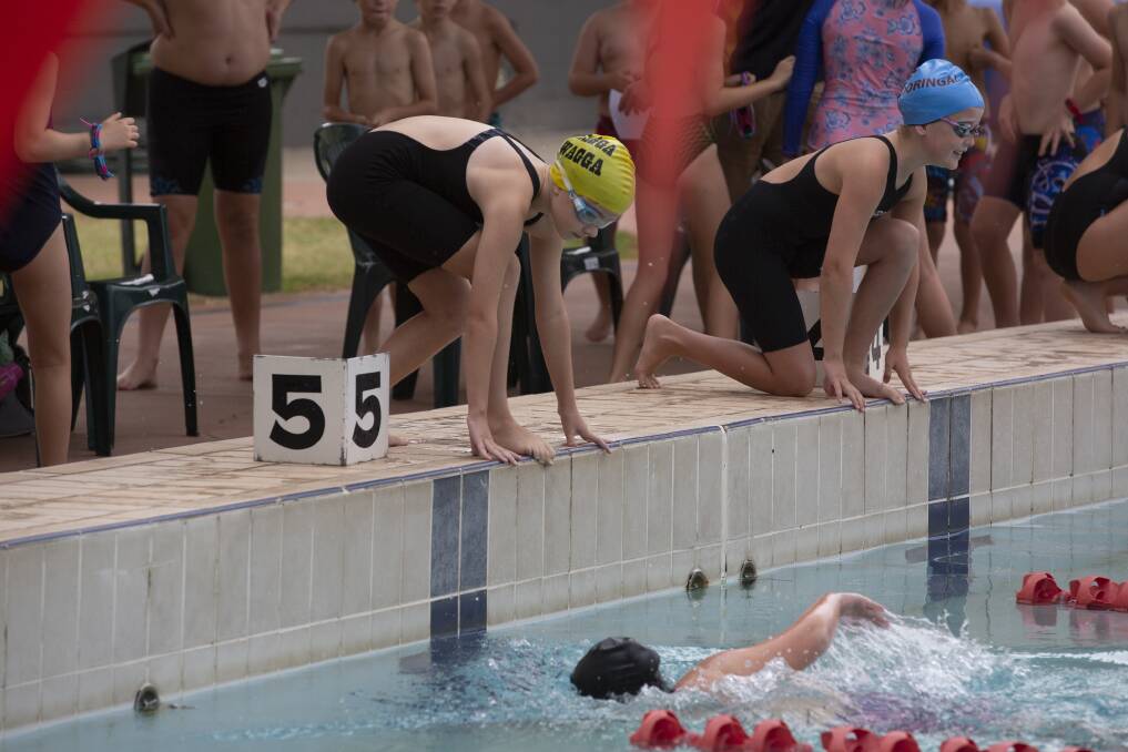 ON YOUR MARKS: Swimmers prepare to hit the water for the relays at the Wagga PSSA carnival at Oasis Regional Aquatic Centre on Tuesday. Picture: Madeline Begley